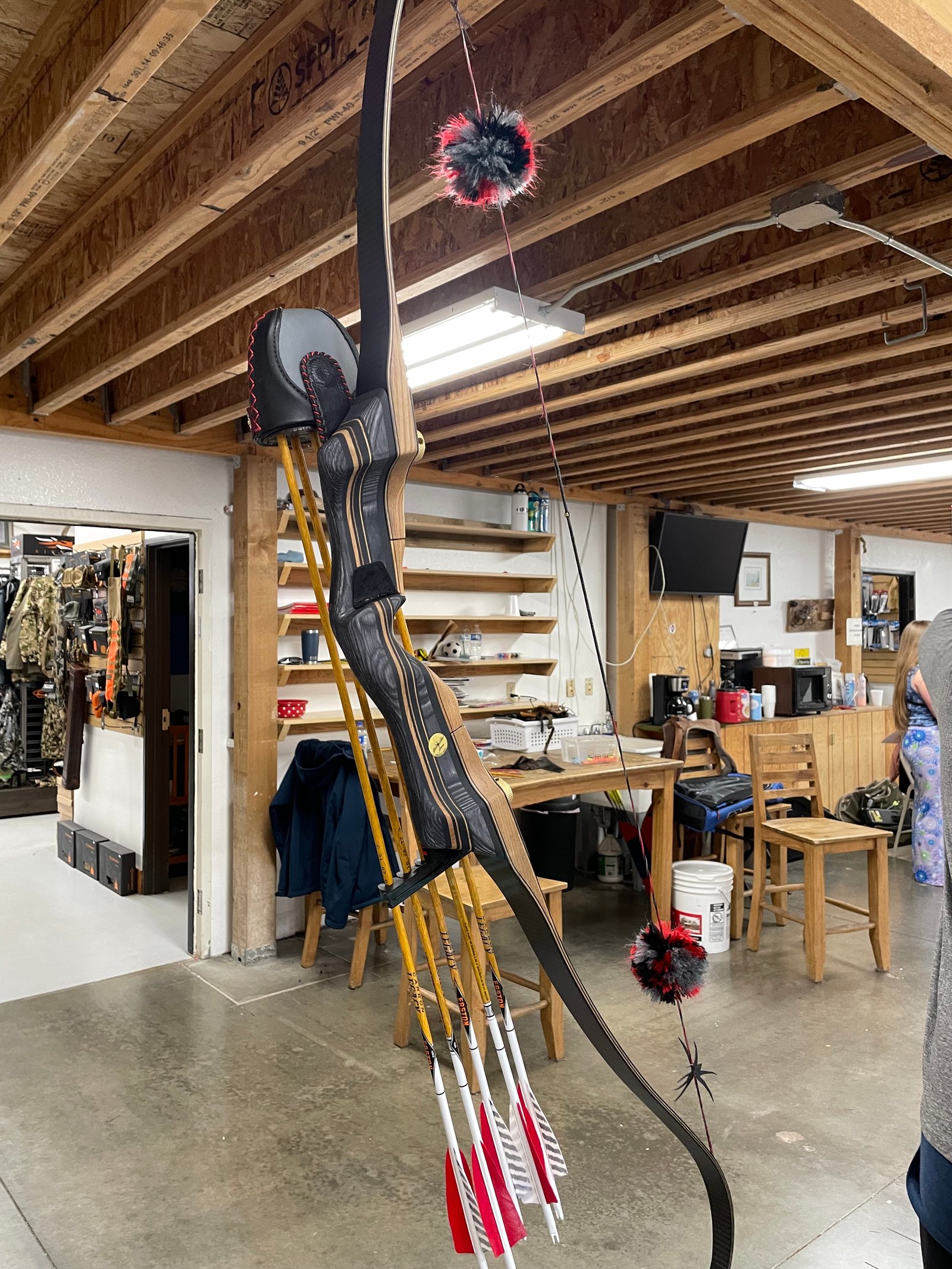 Traditional recurve bow and arrows in the workshop