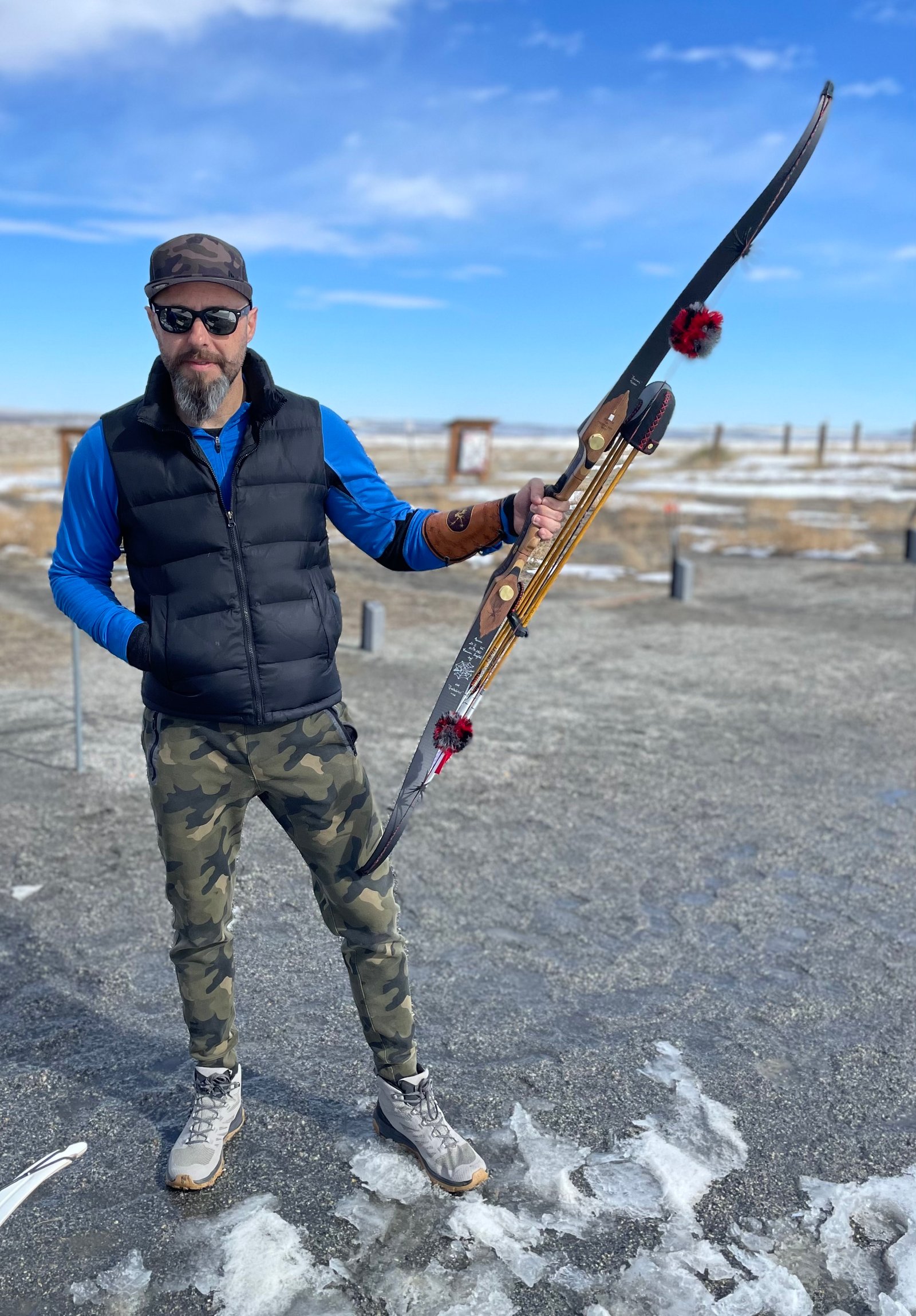 Archer with traditional bow on a winter range